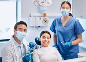 Portrait,Of,Dentist,And,Patient,In,Consultation,For,Teeth,Whitening,
